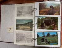 album page with six postcards of covered bridges