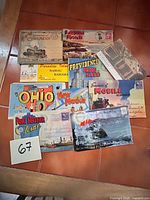 Top view showing ten postcard folders with titles visible