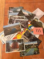 Fronts of assorted postcards showing variety of scenes and designs