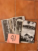 Stack of postcards showing multiple black-and-white architectural views