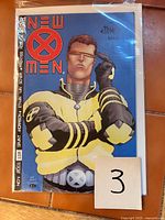 Front cover of New X-Men #119 with Ethan Van Sciver signature