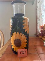 Full view of vase showing sunflower design