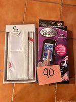 Front view of boxed Stella & Fritz wallet and boxed Touch Purse