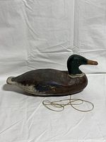Side view of full wooden duck decoy