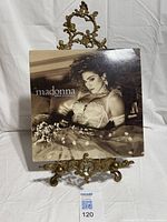 Front cover of Madonna Like A Virgin LP on display stand