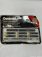 Front of Osmiroid Master Calligraphy Set showing pen barrel, nibs, accessories in blister