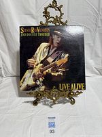 Front cover of album on stand