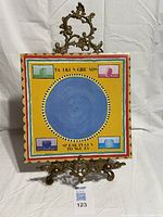 Front cover artwork of LP on easel