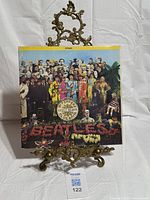 Front cover of gatefold jacket on stand