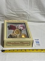 Boxed set showing tape measure for scale