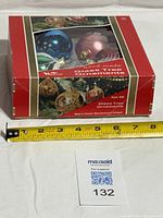 Closed Woolcrest box showing product name and ornaments inside