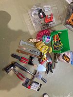 Overhead view of entire lot showing hand tools, straps, cords and boxed power bar