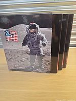 Front of slipcase showing astronaut and volumes