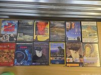 All 14 DVD cases laid out in two rows showing front covers