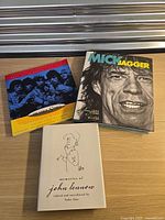 Three hardcover books laid on table showing covers