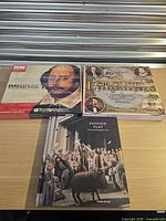 Group shot of three illustrated hardcover books on tabletop