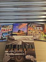 All four books front covers visible