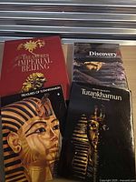 Front covers of all four hardcover books displayed