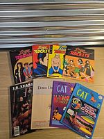 All eight comics laid out in two rows