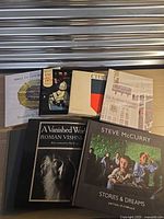 All six hardcover books laid out showing covers