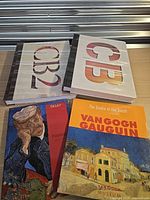 All four oversized books displayed together