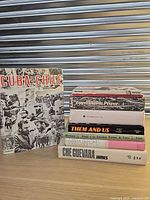 All seven books arranged, spines and covers visible