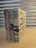 Front spines and dust jackets of the three matching volumes.