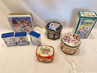 Group shot of all eight tins