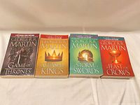 Front covers of all four novels laid side by side