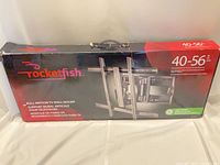 Front of box showing Rocketfish full motion TV wall mount, size and weight specs
