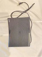 Top view of Samsung BD-J5700 player with power cord