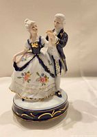 Front view of porcelain dancing couple music box