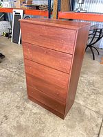 Front view of five-drawer cherry veneer chest