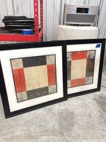 Both framed abstract prints side-by-side showing size and matching design