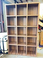 Front view showing 16-cubby grid and overall finish