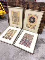 All four framed prints displayed together on floor