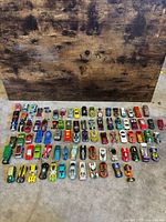 All 85 cars arranged in rows on floor