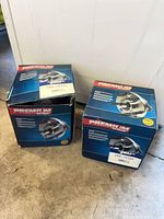 Two closed Premium brand boxes showing product graphics and labels