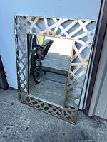 Front view of rectangular mirror leaning against wall