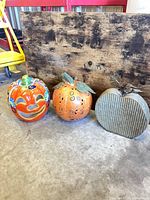 Three decorative pumpkins together