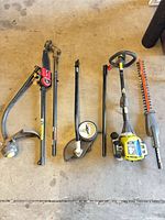 All six lawn tool components laid out side by side