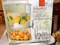 Box front showing beverage dispenser and capacity information