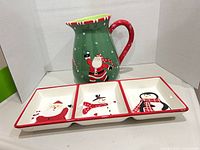 Pitcher and tray front view showing designs and condition