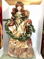 Front view of full angel figurine showing size and attire