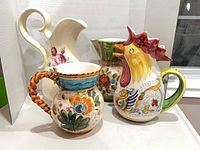 All four pitchers grouped side by side