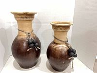 Both vases front view showing shape, color contrast, twine and bead accents