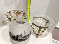 Group view of two compotes, glass globe and shallow bowl
