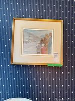 Full view of framed artwork on wall