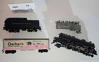 Overview of locomotive, tender, reefer car, and grey shell