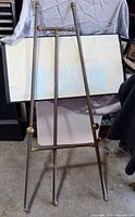 Full view of floor-standing brass easel